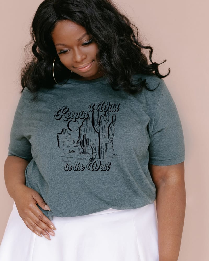 Front of a model wearing a size 2XL Keepin It Wild In The West in Forest by Simply Sage Market. | dia_product_style_image_id:281542